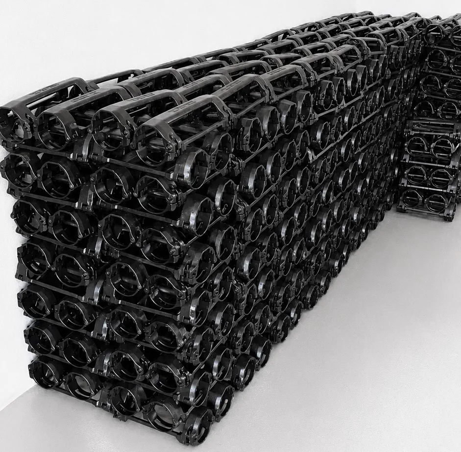 Stacked black oilfield cable protector bodies